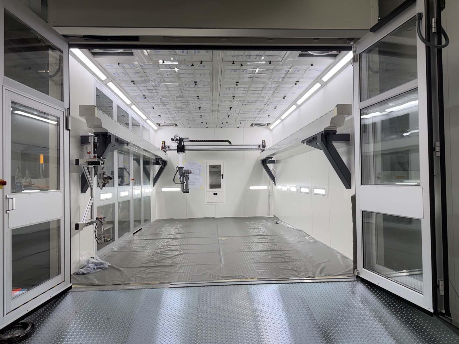 The NST-H8 gantry painting robot installed inside a SEHON custom spray booth in Gechingen, Germany