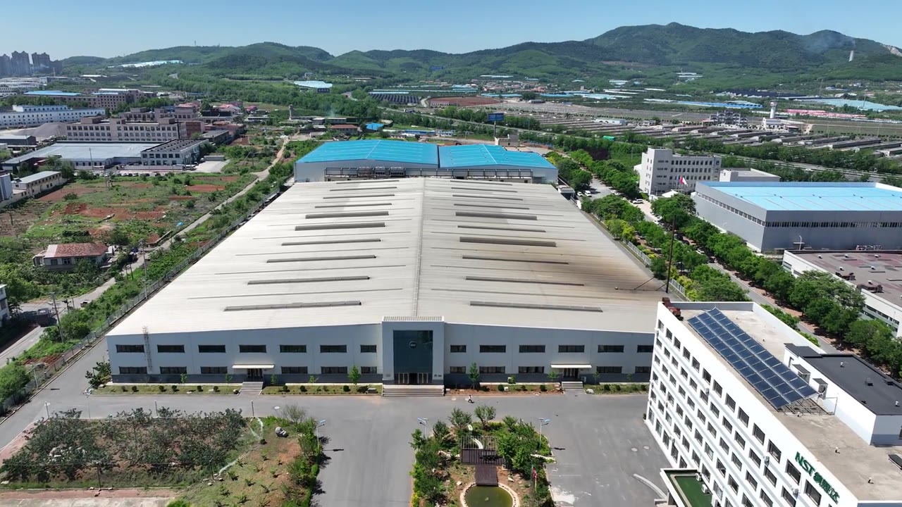 Aerial view of the NST (Dalian Newstar Automobile Equipment Co., Ltd.) headquarters and manufacturing campus in Dalian, China
